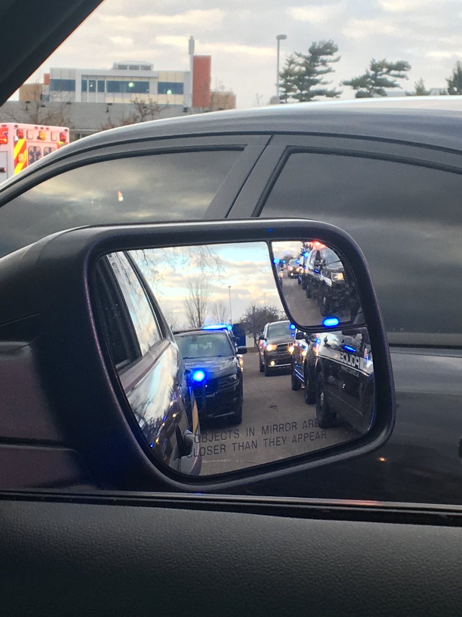 OUPD's tweet photo. Last night we joined multiple other agencies across Oakland County to show @BeaumontHealth and all of their staff on the front lines support and encouragement. This #SolidarityLap showed that we are all in this together and that we will get through it by leaning on each other. https://t.co/TnMKcrDSEu
