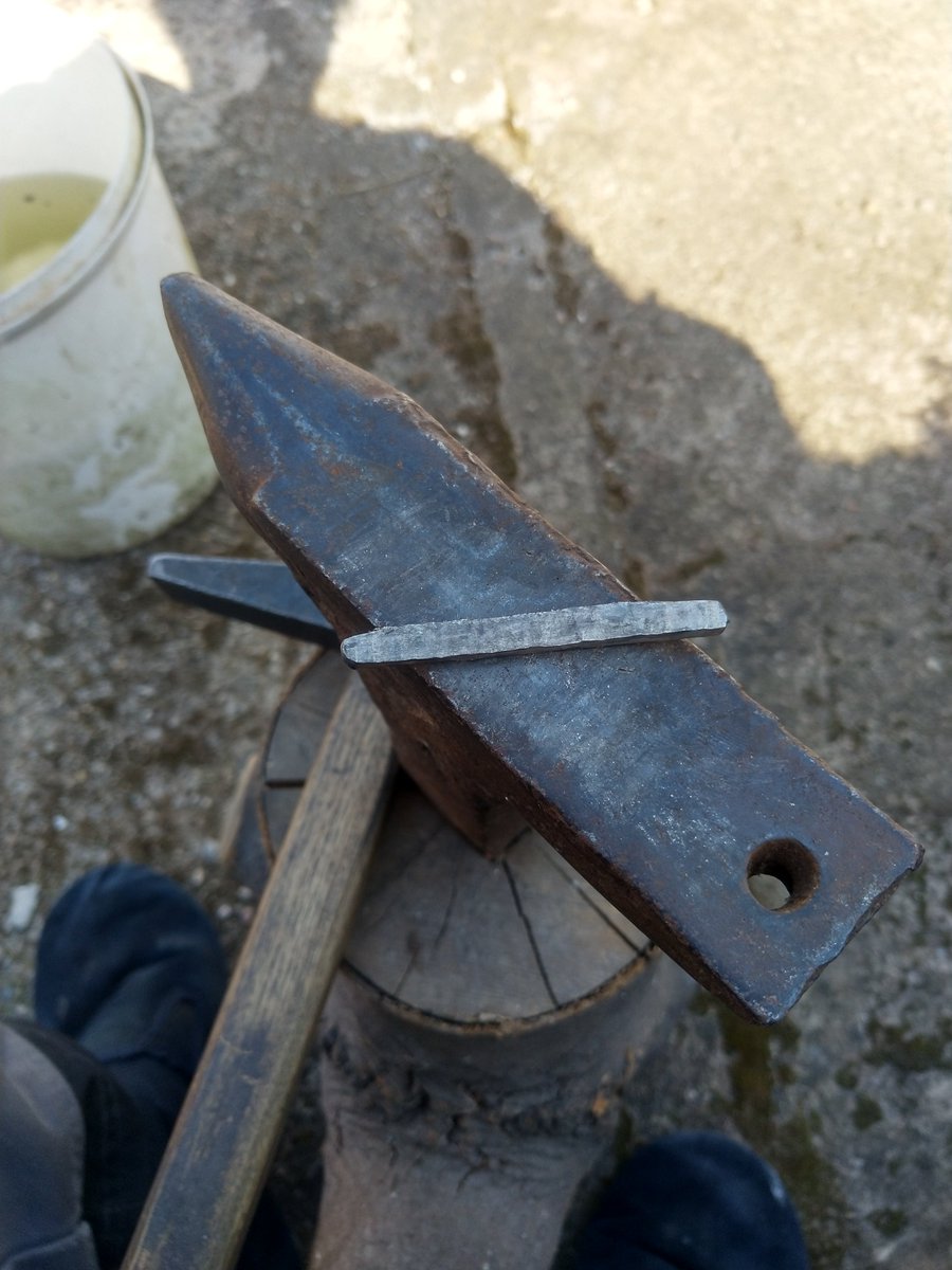 To make the bar longer, the cross-pane of the hammer is used, rather than the flat end. This gives more control over the way the bar stretches out. The bar is becoming more rectangular in section, making it easier to hammer consistently.