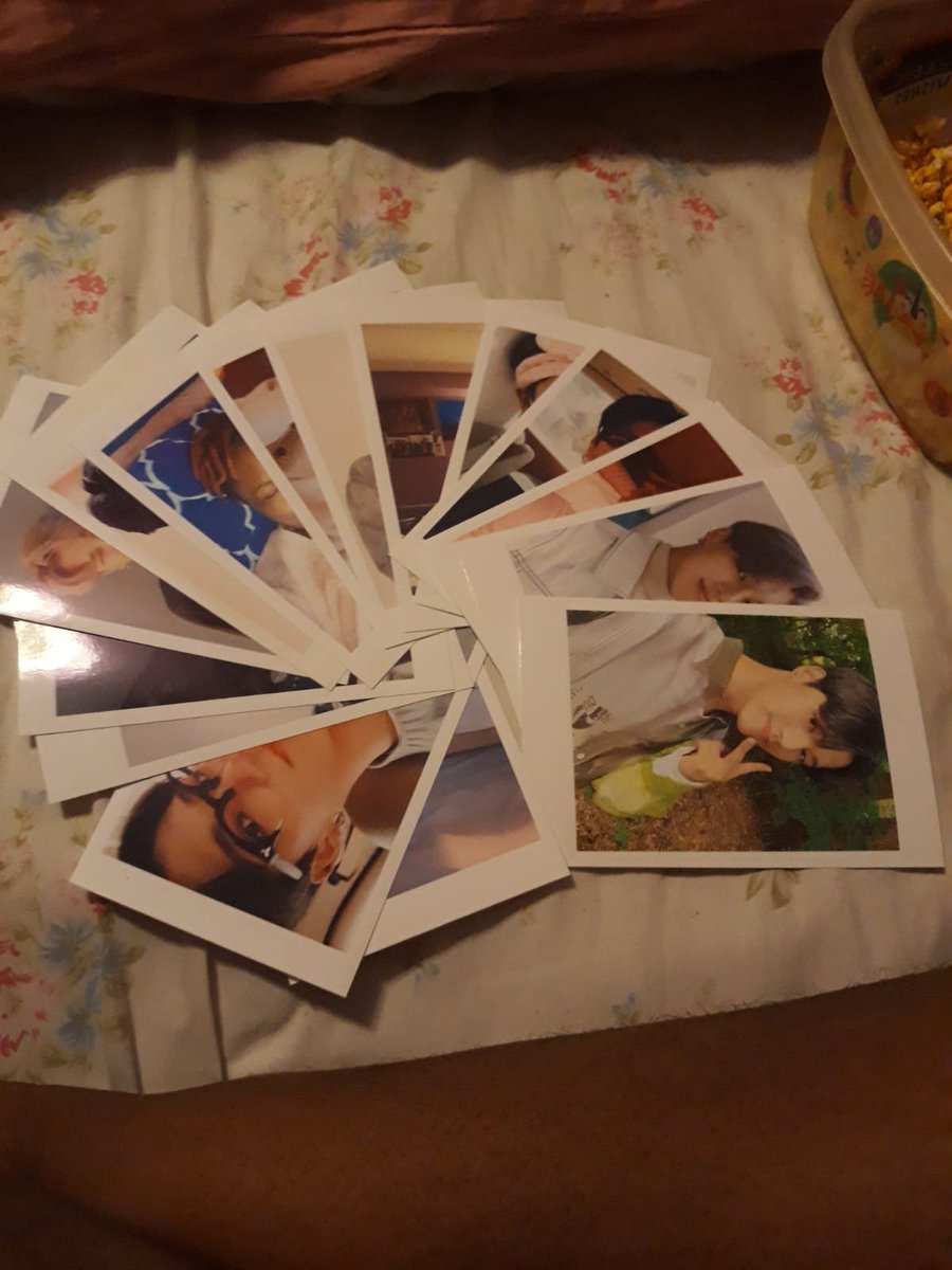 so i print out 17 polaroids (it started out as 15 but then i couldnt resist adding two more since we met at a svt concert) the polaroids are her top 10 fave wooyoung pics, her top 5 fave selfies ive sent and 2 of her fave jihoon pic (not all polaroids pictured)