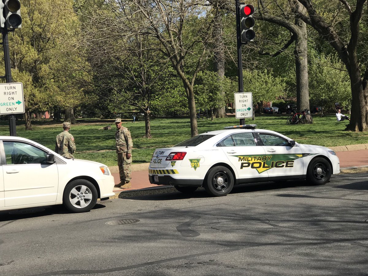 Military police are out at 11th Street and [what will someday be known other than] Constitution Avenue NW to keep residents out of their public park. At least 11 DC police cruisers. Happening right now. ⁦ @ChrisPlanteShow⁩