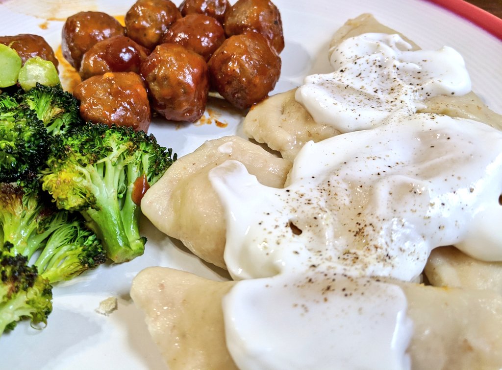 And here's dinner, with our pierogies as the main course, served with sour cream, salt and pepper.Ukranian comfort food achieved.Not as good as dinner with Grandma, but as close as we're going to get right now.