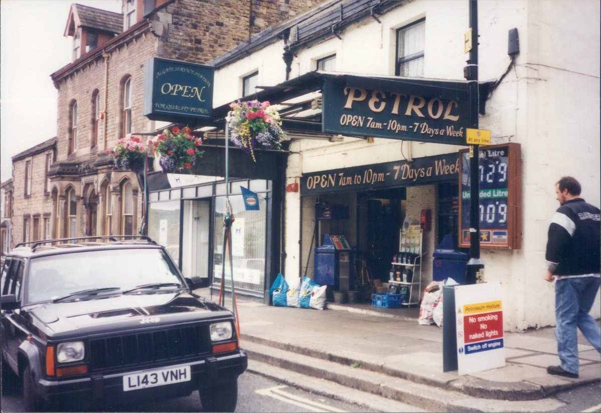 Day 110 of  #petrolstationsGalgate Service Station, Barnard Castle, Co Durham  https://www.flickr.com/photos/danlockton/16084695427/  https://www.flickr.com/photos/danlockton/16270562195/A 2-part garage, either side of the street on Barnard Castle's Galgate. Note the swing arms out over the pavement for the hoses. Unbranded—former Burmah