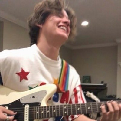 noah urrea playing guitar; a necessary thread
