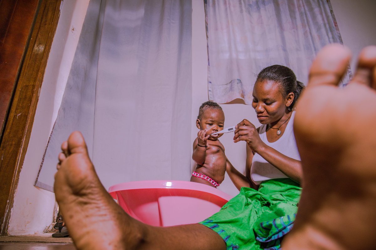 KusetDeo's tweet photo. A mother Checking Temperature of her Child .@covid19 @MinofHealthUG @UPPAward #shootyourlockdown #everydayuganda. https://t.co/usdOCi5MiE