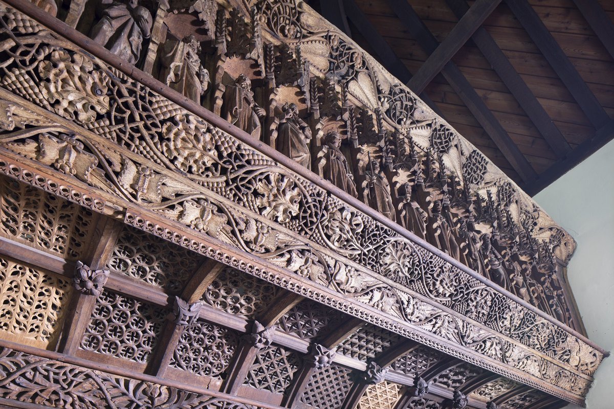 The majestic 15th-century roodscreen fills the interior. It bursts with life: the bressumer trails with vines, pomegranates and water-plant issuing from the mouth of a wyvern.The vines symbolise Christ. The pomegranate represents eternal life.(2/7)