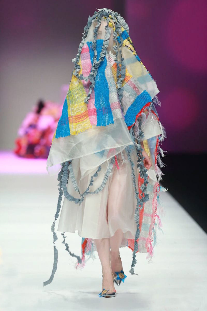 She aims to blend Eastern and Western aesthetics and often creates colorful cool collections.