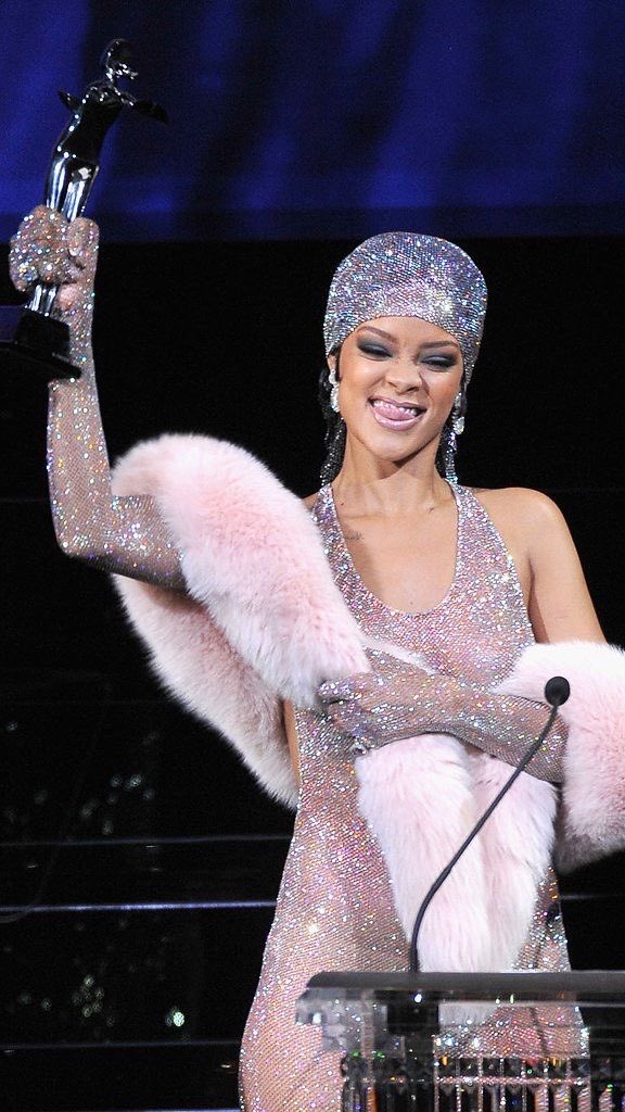 Rihanna was awarded as the CFDA's Fashion Icon in 2014. She received the award in this controversial see-thru dress filled with 230,000 swarovski crystals (including her cute little durag) custom made by Adam Selman and styled by Mel Ottenberg. does her t*ts bother you? 