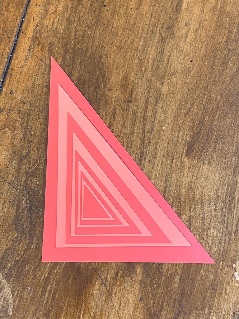 The card was a different colour on each side which added some interesting patterns. Each size triangle was reversed. I didn’t expect this! The second pattern is essentially a pursuit curve.   #mathartchallenge