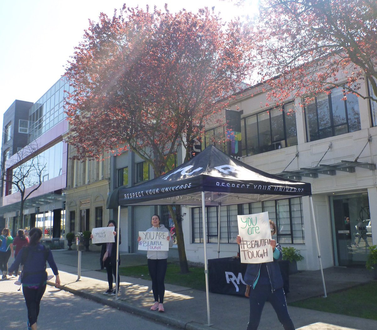 corrwest's tweet photo. Celebrating today the 36th Anniversary of the Vancouver Sun Run (cancelled 2020 due to Covid19 pandemic) by posting pictures from prior years. βBeautiful Toughβ signs 2018. #MySunRun #Vancouver https://t.co/f7ukcuGENf