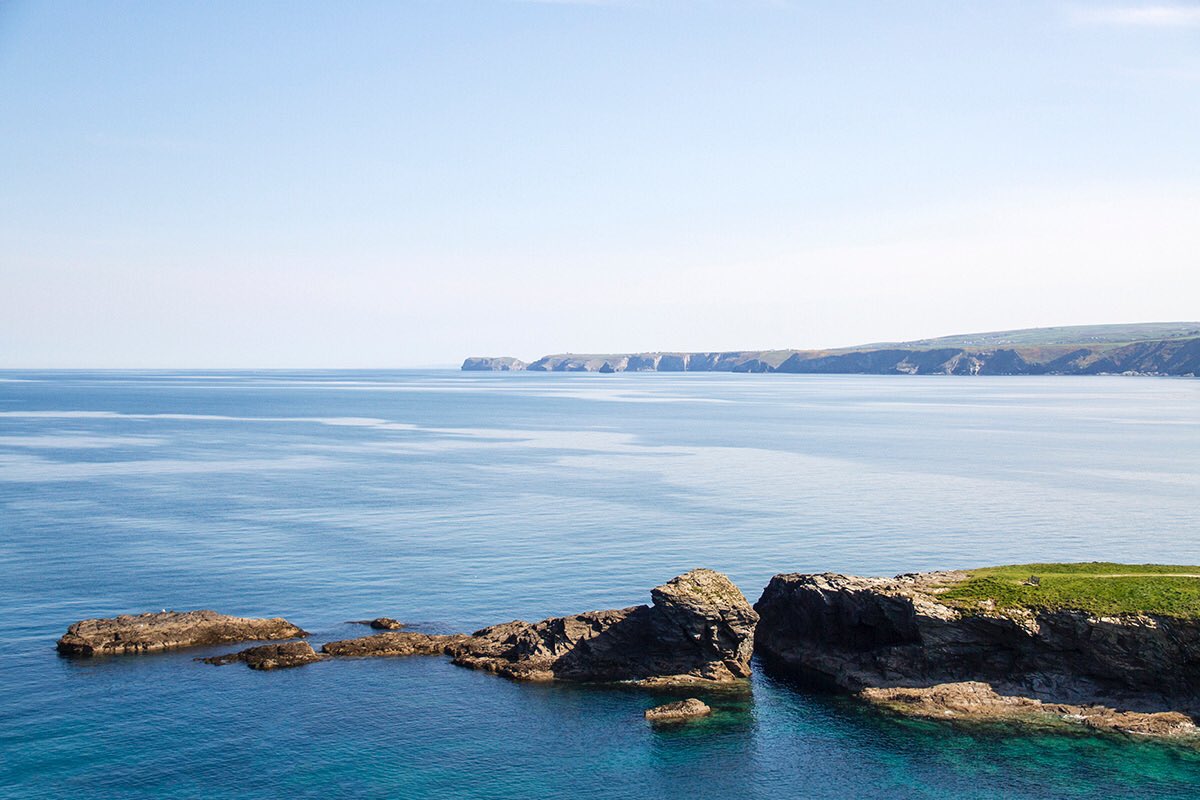 CornishRockTors's tweet photo. Looking out over Castle Rock and The Main towards Tintagel Head on a beautiful day, about this time a couple of years ago.  

We can't wait until it's safe for us to get back to sharing this stretch of coastline with you in person, rather than just digitally.

#cornwall #stayhome https://t.co/40MvD1F9OM
