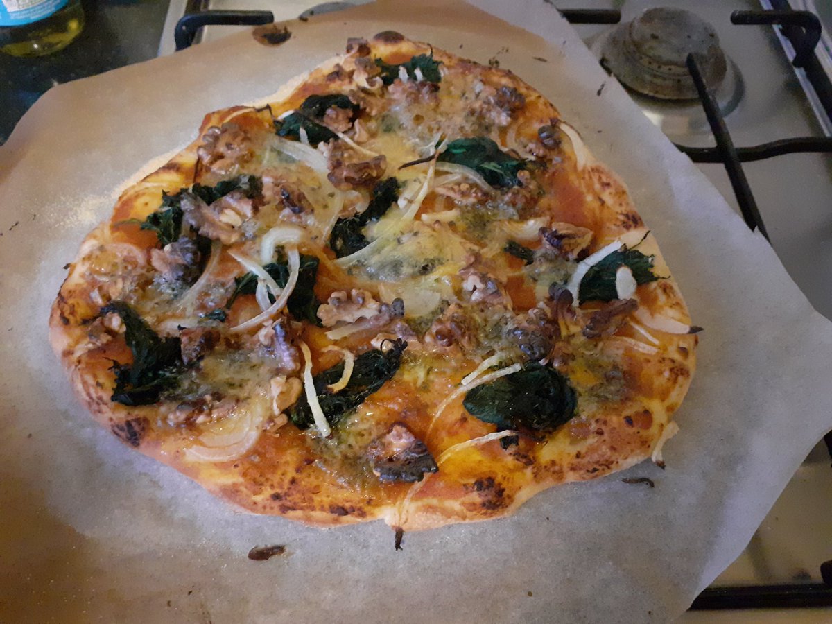 Lockdown sourdough pizza! Goat's cheese, basil and harissa / stilton, walnut and spinach. Plus some sesame, ginger + cinnamon biscuits made with barley flour and jaggery - actually made by me and also actually delicious