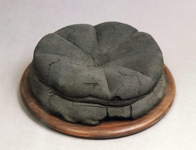 Nobody is really sure where hot cross buns originate from! Spiced bread made with dried fruit has a long history, and buns/loaves with similar score marks on the crust have been around for ages (the one below is from Modestus’ bakery in Pompeii)