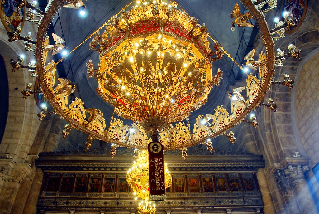 What is very interesting is that in Orthodox Churches, right under the main naos dome, right under the image of "Christ in heaven", we find a circular chandelier called "horos" (circular dance???) with many candles on it... https://en.wikipedia.org/wiki/Polyeleos#Chandelier