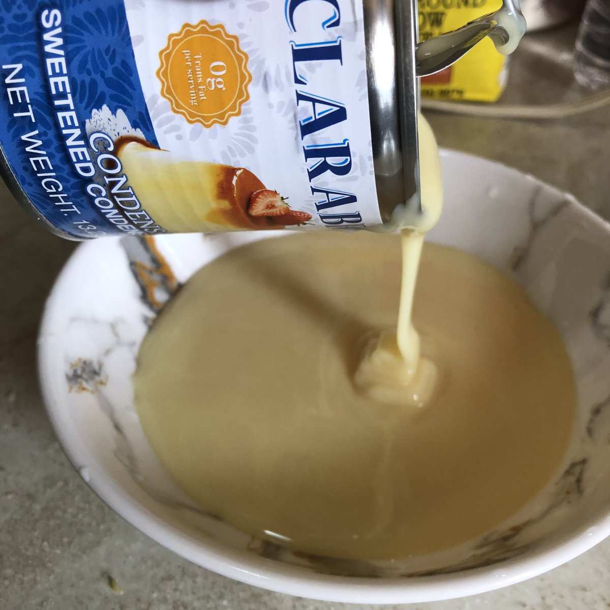 Because we are doing a no machine ice cream I will be whipping cream. To give it more flavor I am mixing sweetened condensed milk, vanilla extract and cinnamon