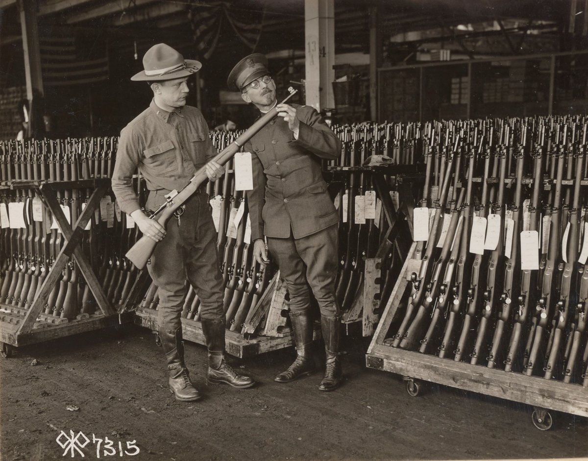 United States officers inspecting rifles:  https://catalog.archives.gov/id/55175424 