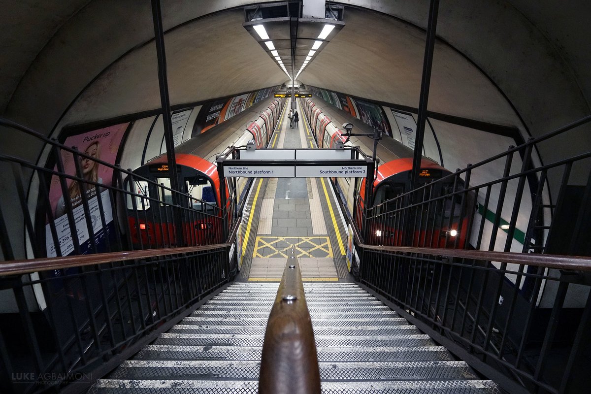 LONDON UNDERGROUND SYMMETRY PHOTO / 42CLAPHAM COMMONDouble exposure looking down at two trains on the slim island platform.  http://instagram.com/tubemapper   http://shop.tubemapper.com/Clapham-Common-Station/Photography thread of my symmetrical encounters on the London UndergroundTHREAD