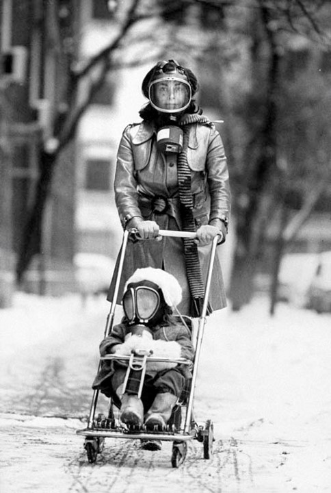 Earlier that year, Life magazine did a feature article on the environment. The issue began with a photograph of a woman pushing a stroller. Both the woman and the toddler are wearing gas masks.