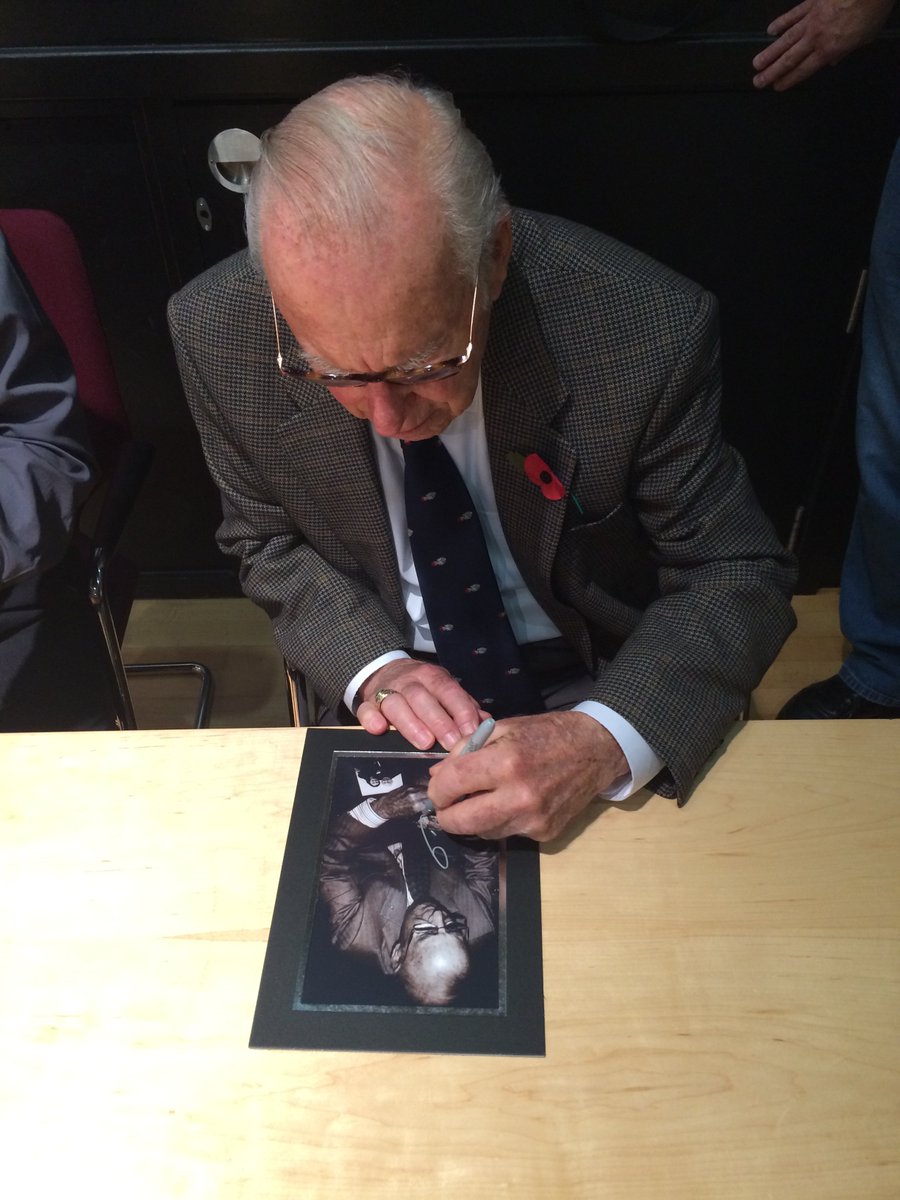 It's a photograph. A special photograph indeed. It's a photograph of Jim Lovell, and he's signing a photograph of Jim Lovell signing a photograph of Jim Lovell with a picture of me and Jim Lovell on the table beside it. And it makes me smile. A lot.  #Apollo13