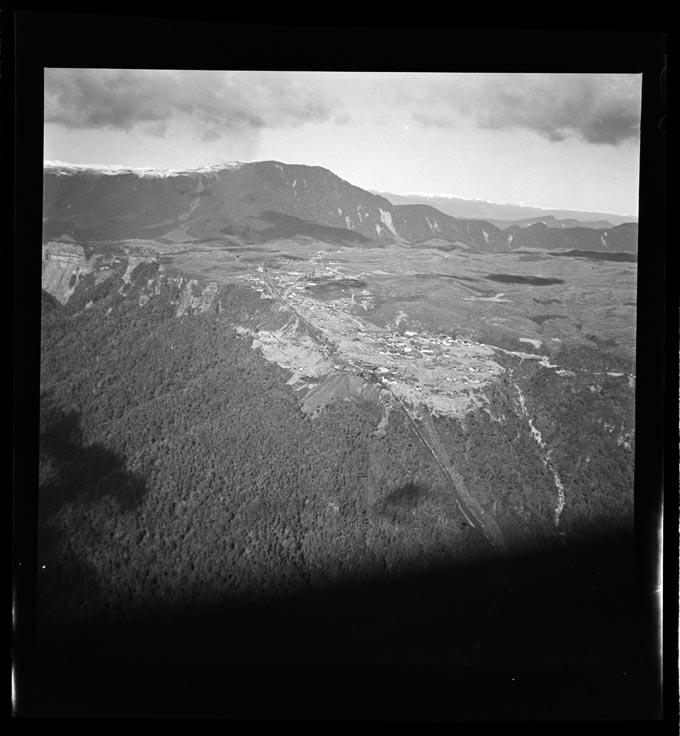 Where was that last photo taken from? High on the Rochfort Plateau at Denniston. It was once a significant mining town. Here are two aerial photos from the Nelson Provincial Museum (photo ref. nos 325551 and 325552).