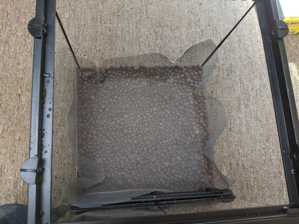 Step three: Separation.It's important to separate the substrate from the false bottom. The separator must be water-permeable but not something that will readily react with water like metal or paper. I went with a fiberglass window screen.