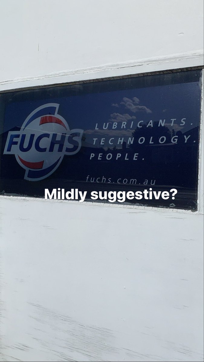 A sign on a building that says “Lubricants. Technology. People.” Mildly suggestive?