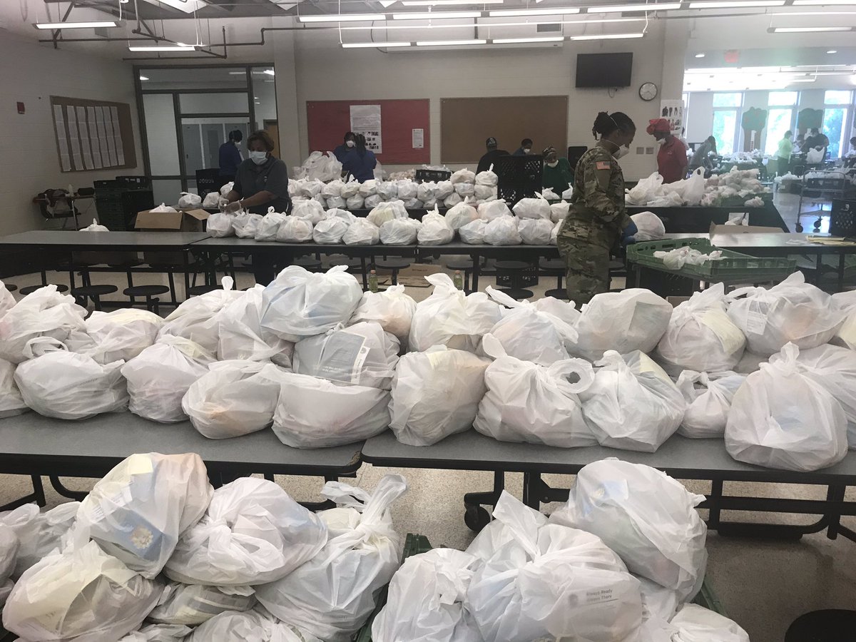 CarstarphenMJ's tweet photo. It’s time for school, APS! Buses are about to start routes! Food is ready and getting loaded! BIG DAY food distribution &amp; learning! Thank you @GANATIONALGUARD for you help and support! Plus our amazing volunteers and APS team members are working hard too! https://t.co/OuooI31heQ