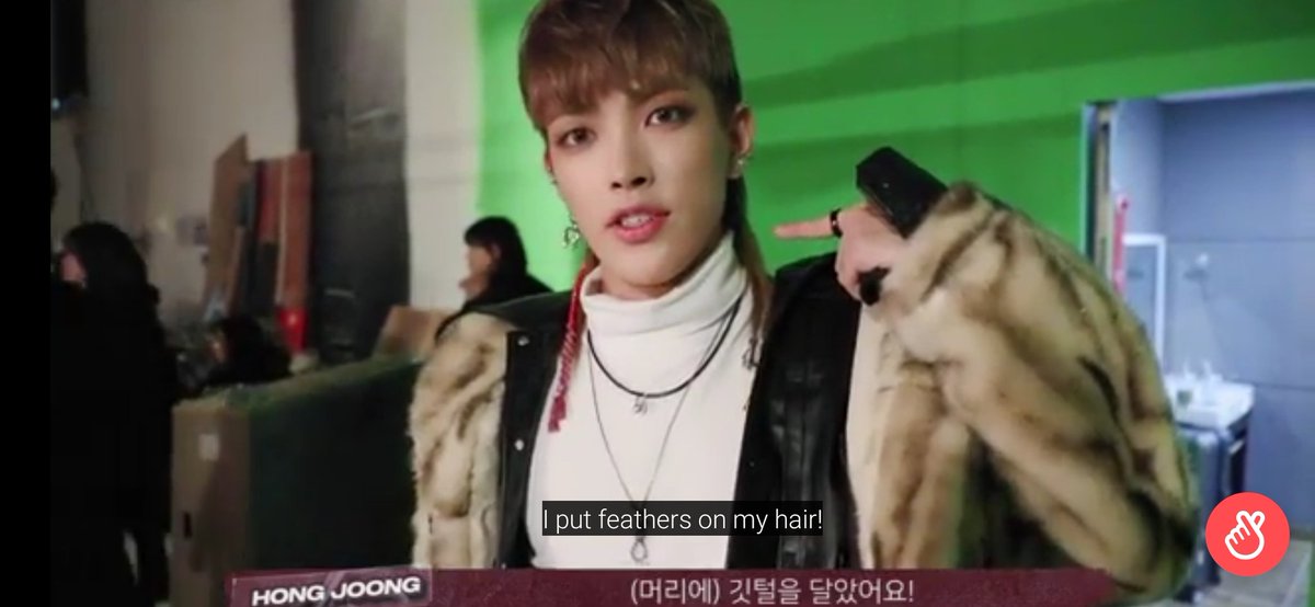 Hongjoong said he has a feather on his accessories to represent the weak ateez and look at this.