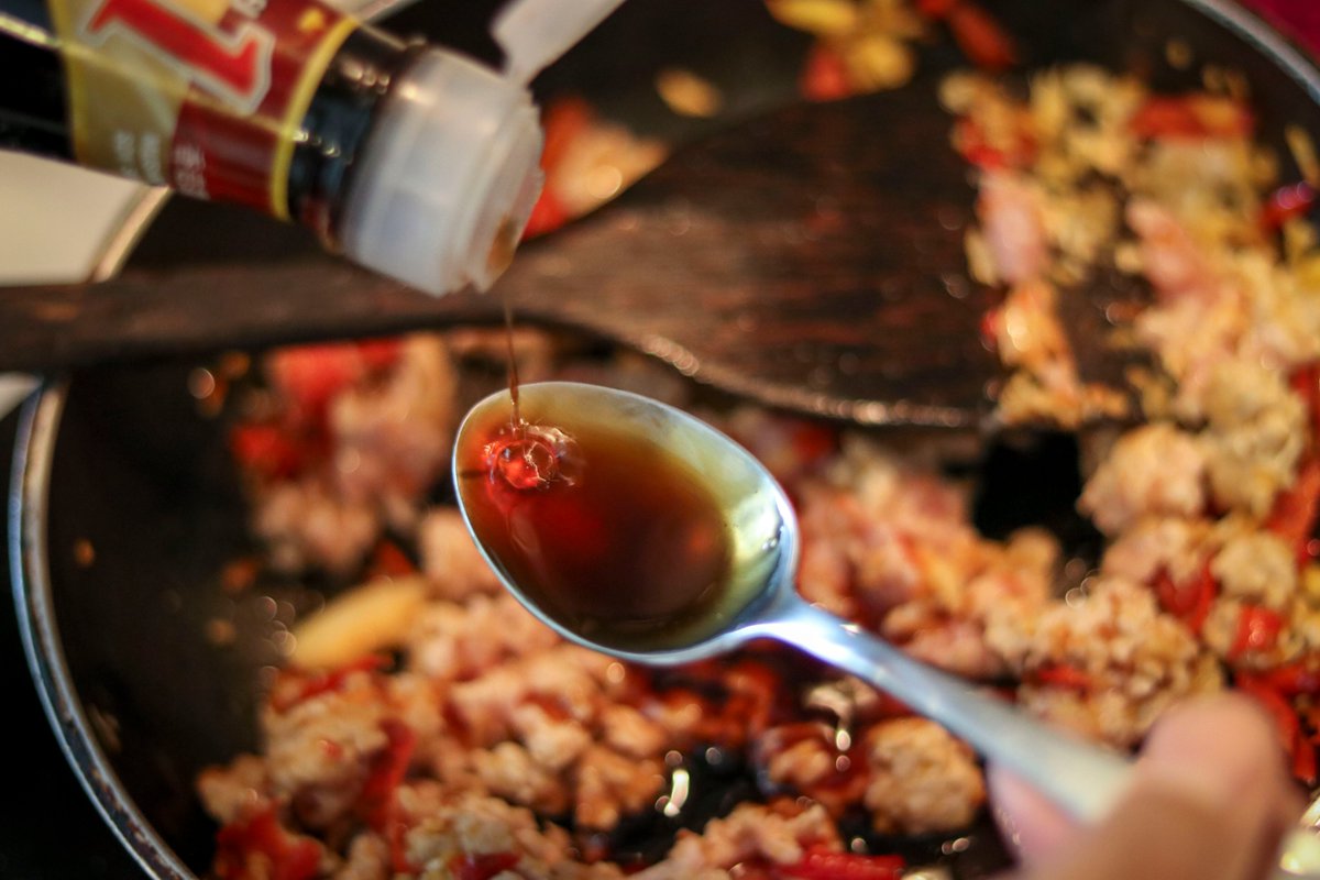 Wait until the pork is cooked. Then add the sauces:- 2 spoons of Oyster Sauce- 1 spoon of Thin Soy Sauce and Soy Sauce- half a spoon of Black Soy Sauce and Fish Sauce- half a spoon of sugar and seasoning powder