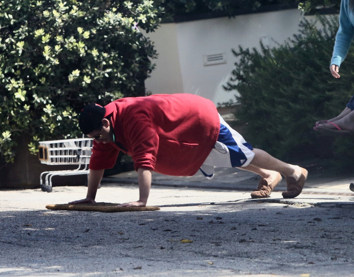 April 13: Obviously it's fit god Adam Sandler doing push-ups