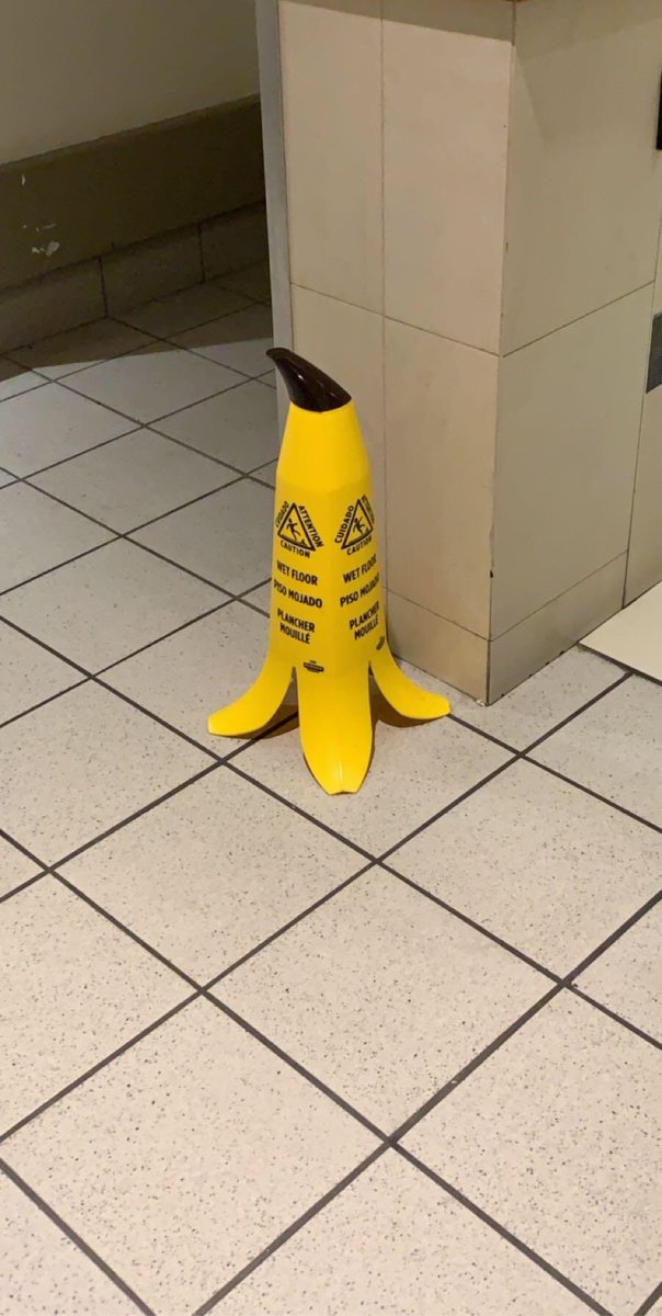 DunnyDesign's tweet photo. I’m here for this visual metaphor of wet floor signs that look like banana peels.👏👏👏 Top notch #DunnyDesign! https://t.co/EbeP7gheDA