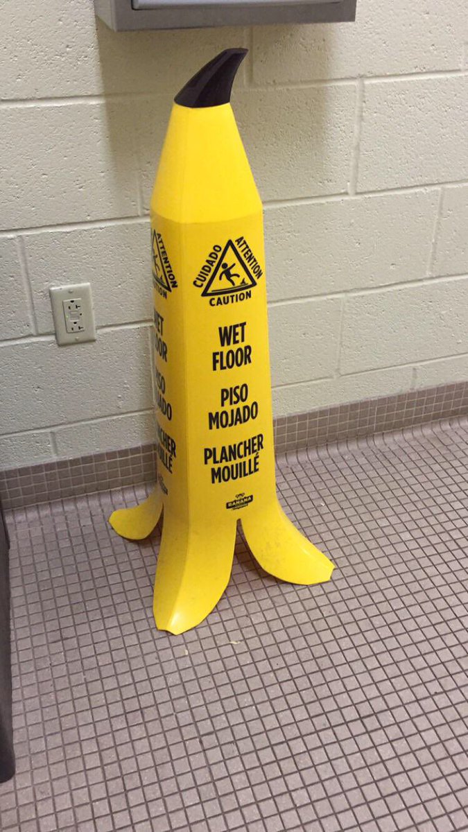 DunnyDesign's tweet photo. I’m here for this visual metaphor of wet floor signs that look like banana peels.👏👏👏 Top notch #DunnyDesign! https://t.co/EbeP7gheDA