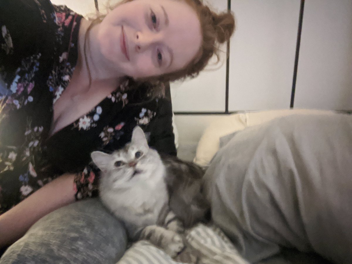 Doesn't he look like he's smiling?! Asks woman socially isolated with her cat. #CatsOfTheQuarantine