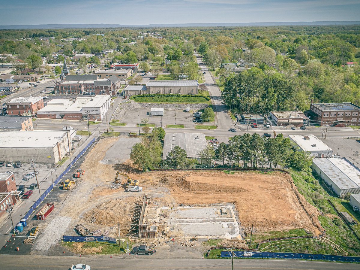 AmericanConst's tweet photo. 👷‍♂️👷‍♀️ Grading, footings, and retaining walls are underway onsite for the Tullahoma Police Department project on West Grundy Street!  Going vertical soon and looking forward to seeing the building and parking areas take shape.🏗️🚧 https://t.co/5weYERsVST