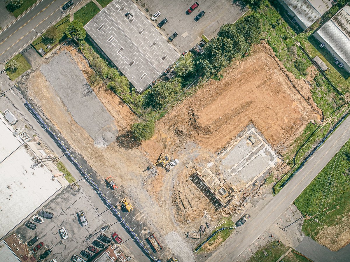 AmericanConst's tweet photo. 👷‍♂️👷‍♀️ Grading, footings, and retaining walls are underway onsite for the Tullahoma Police Department project on West Grundy Street!  Going vertical soon and looking forward to seeing the building and parking areas take shape.🏗️🚧 https://t.co/5weYERsVST