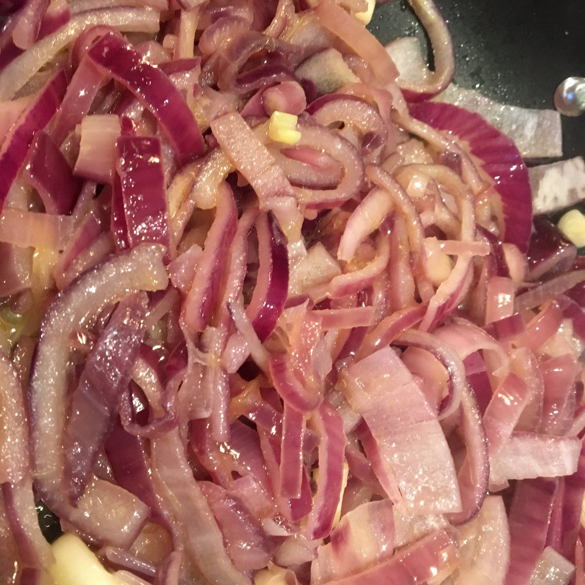 Now biryani is all about luxury so fry down your massive amounts of onion in massive amounts of ghee. You need this full pan of onions to sweat down like spinach. They need to be browned until they resemble Ken Dodds hair. This will take ages, which is good for that marinade.