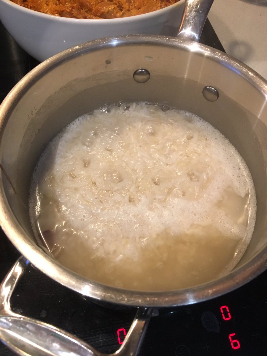 LETS TEAR UP THE RULES AND MAKE RICE BADLY! Why? Because it will keep cooking in the oven so we are just par boiling. Instead of using 2 cups water to 1 cup rice only add 1 & a 1/2 cups of water, and don’t cover it. Boil the water out and you should be left with half cooked rice.