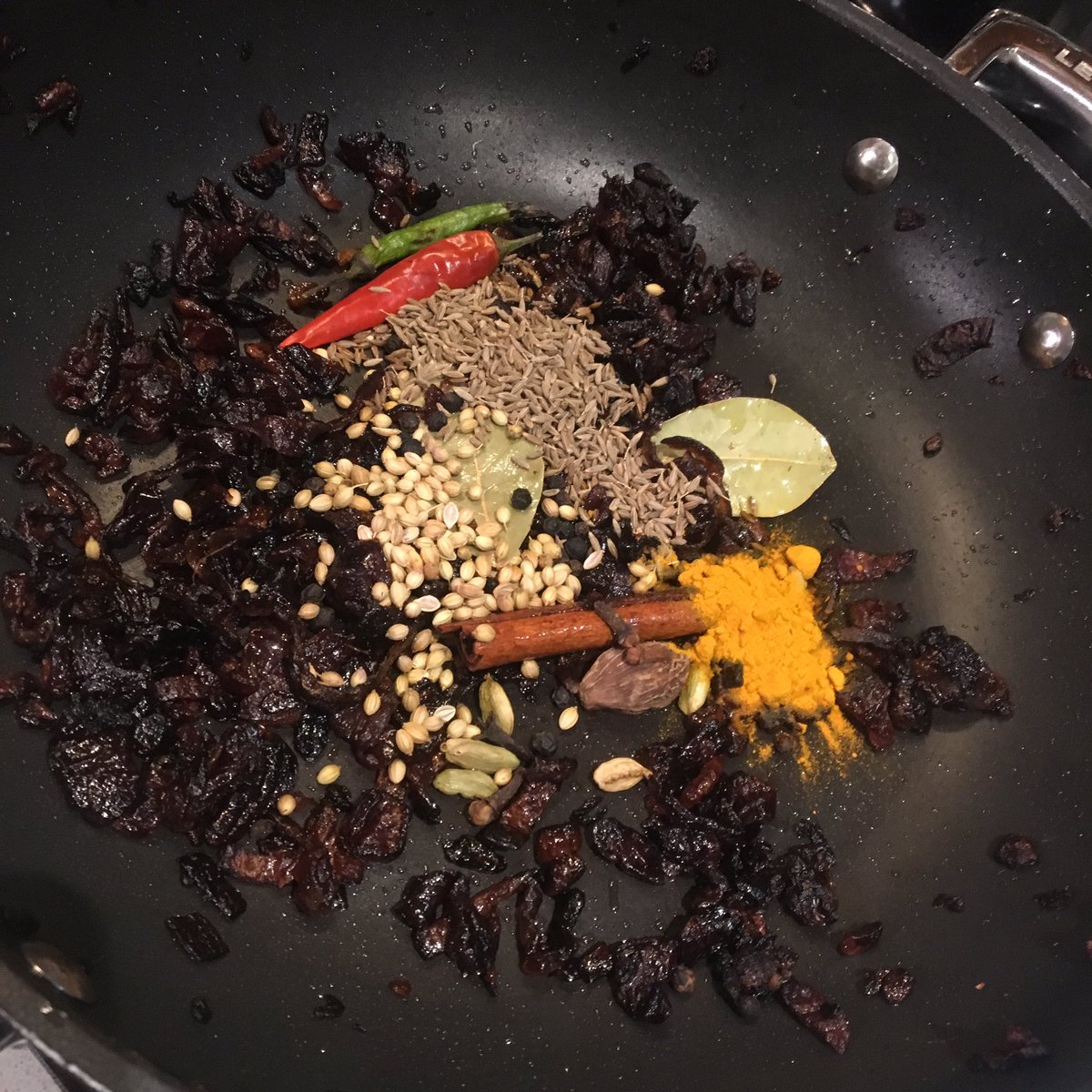 Set half the onions aside then add a dab more ghee, bay leaves, cinnamon stick, 2 whole chillies (stabbed), coriander seeds, cumin, turmeric, 6 cardamon green, 1 black, 6 cloves and a teaspoon of black peppercorns (whole). Toast em up till smell is unbelievable.