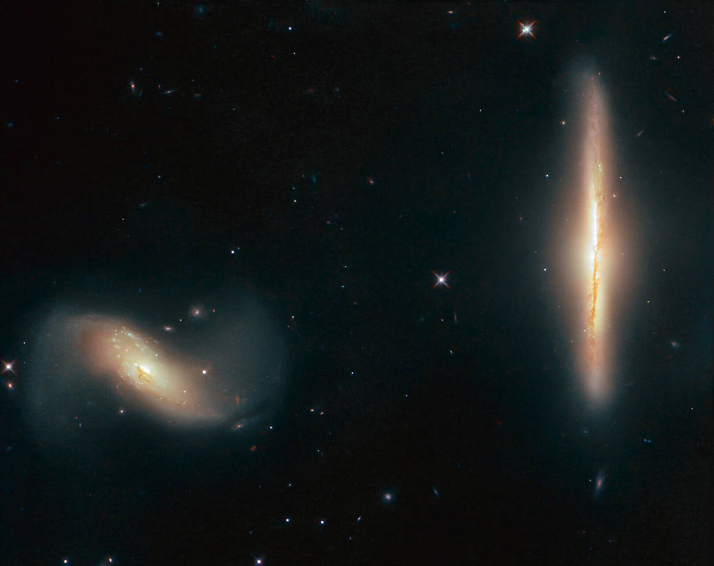 These two galaxies may be closer than most, but don't worry, they're way more than six feet apart. Individually called NGC 6285 and NGC 6286, as a duo these two interacting galaxies are called Arp 293. More:  https://s.si.edu/2V3eYsN : ESA/Hubble & NASA, K. Larson et al.