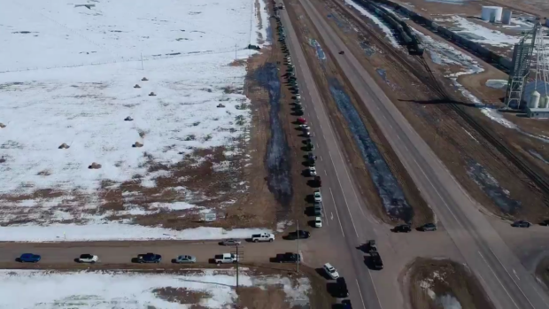 BarDown's tweet photo. Over 15km of cars lined up in tribute to Colby Cave as his family returned to Saskatchewan. MORE @ https://t.co/sSYiDH4gTL https://t.co/loHHx0fSQt