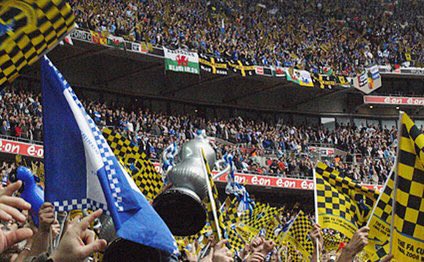 2008 FA Cup Final. Cardiff City were in the second tier and played Portsmouth in the final. 89,874 fans went to the game, and that is the highest football attendance at Wembley to this date.