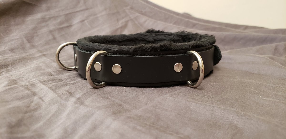Today I'm featuring my collection of locking collars in this thread.Here is my fur-lined leather collar from Strict Leather. It has three steel D-rings and a steel buckle that accepts a normal padlock or a timer lock. It's very comfortable due to the soft fur lining. Semi-rigid.