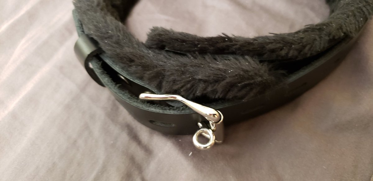 Today I'm featuring my collection of locking collars in this thread.Here is my fur-lined leather collar from Strict Leather. It has three steel D-rings and a steel buckle that accepts a normal padlock or a timer lock. It's very comfortable due to the soft fur lining. Semi-rigid.