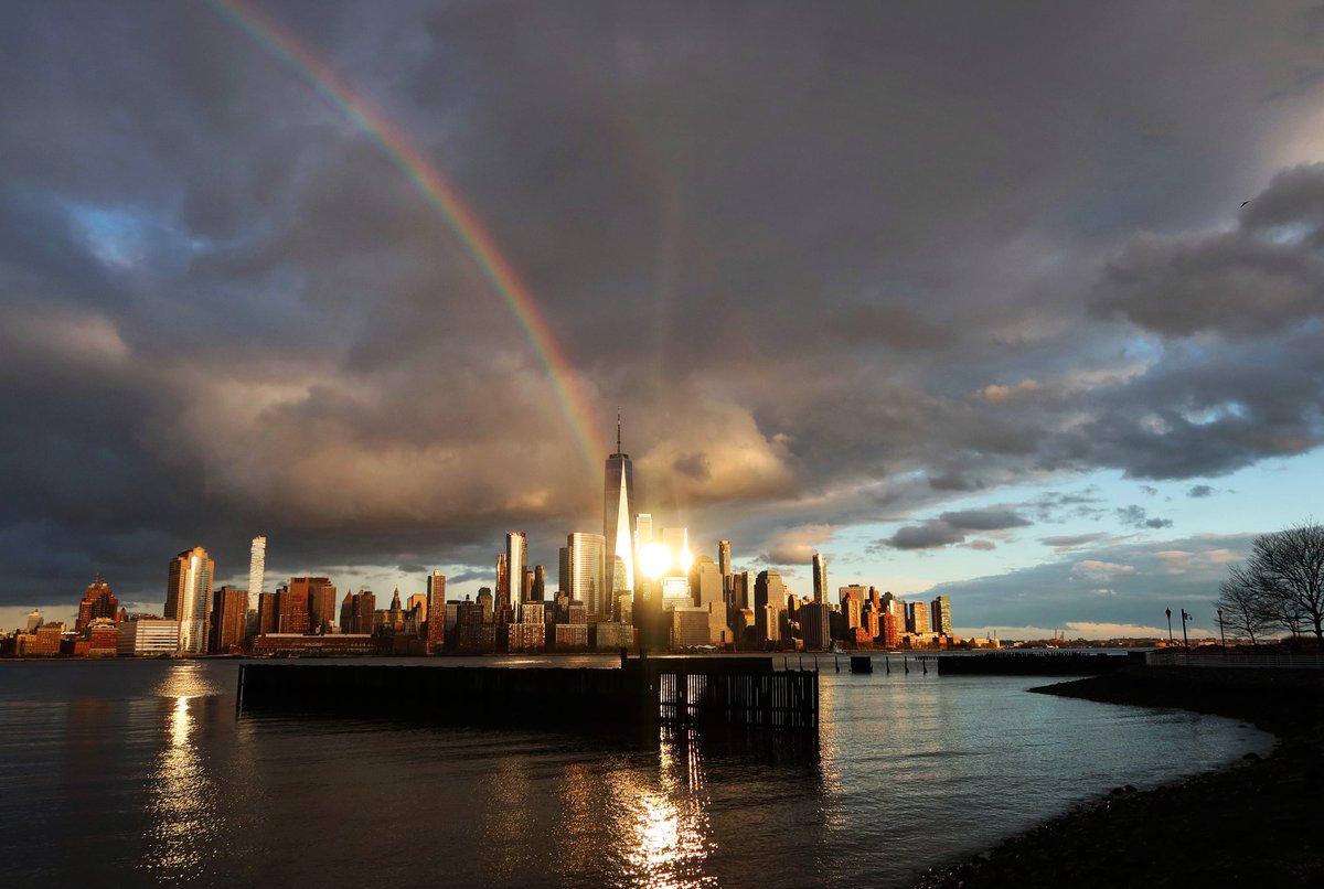 GaryHershorn's tweet photo. Last night's sunset rainbow over the Empire State Building and One World Trade Center in New York City #newyork #newyorkcity #nyc @EmpireStateBldg @agreatbigcity @_WTCOfficial #rainbow @NYGovCuomo https://t.co/qa0V46haGX