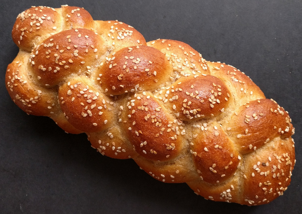KhallahA loaf of braided bread that is made from flour, yeast, salt, and an inordinate amount of eggs. Many East European countries adopted khallah from the Jews who lived among them, and developed their own versions.