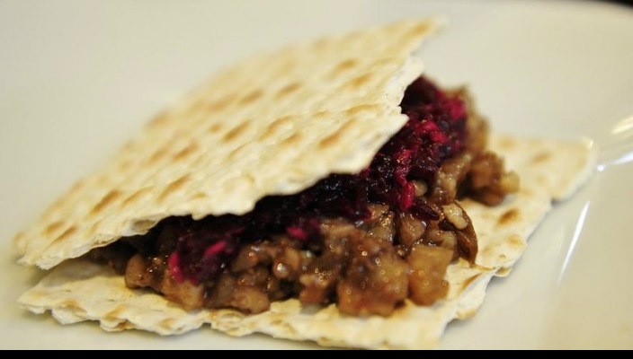 Hillel KarikhIt is two pieces of matzah with small cut-up, cooked goat/sheep meat, kharoset, fruits, leafy vegetables, and maror in between.