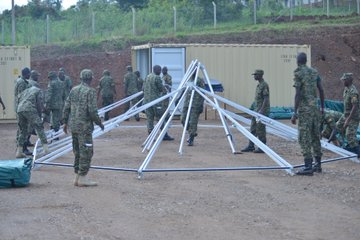 JINJA, Uganda--Soldiers from Uganda People’s Defence Force work to set up the frame of a UN-standard level-2 mobile treatment facility at the Uganda Rapid Deployment Capabilities Center in Jinja, Uganda, May 13, 2019, as a part of vendor training under the African Peacekeeping Rapid Response Partnership program. (Photo by U.S. Army Staff Sgt. Grady Jones, Public Affairs, U.S. AFRICOM)