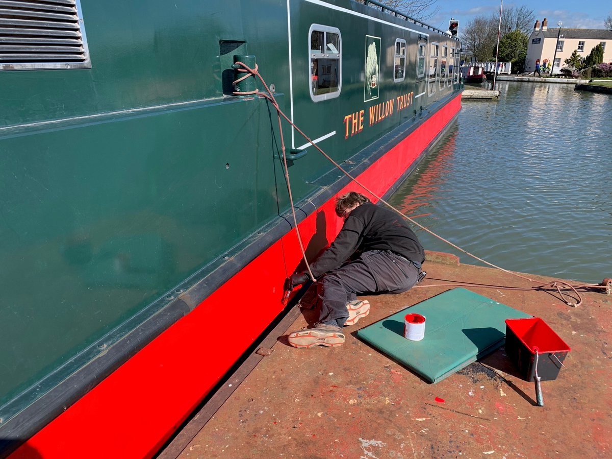 Leonard Matchan's hull is being sanded and repainted by John, one of our skippers