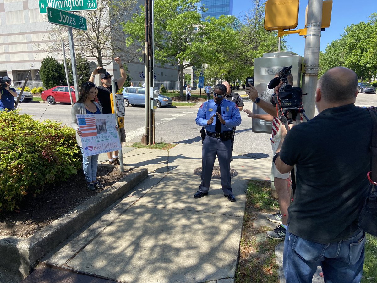 As  @raleighpolice &  @NCLeg GA Police get involved, some shout of “tyranny, “Gestapo” & “Comrade  @NC_Governor.” Despite increase in volume, protest still peaceful. There are several families and school aged children here as well.  @ABC11_WTVD  @ABCPolitics  @ABC  #abc11  #stayathome  