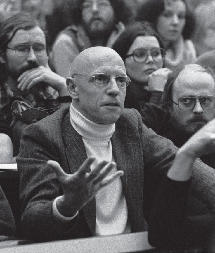 Here is noted turtleneck wearer Michel Foucalt, who definitely perfected the Eurotrash philosopher in a turtleneck look, wearing an actual turtleneck.Note the collar position. It& #39;s rolled almost to his chin.