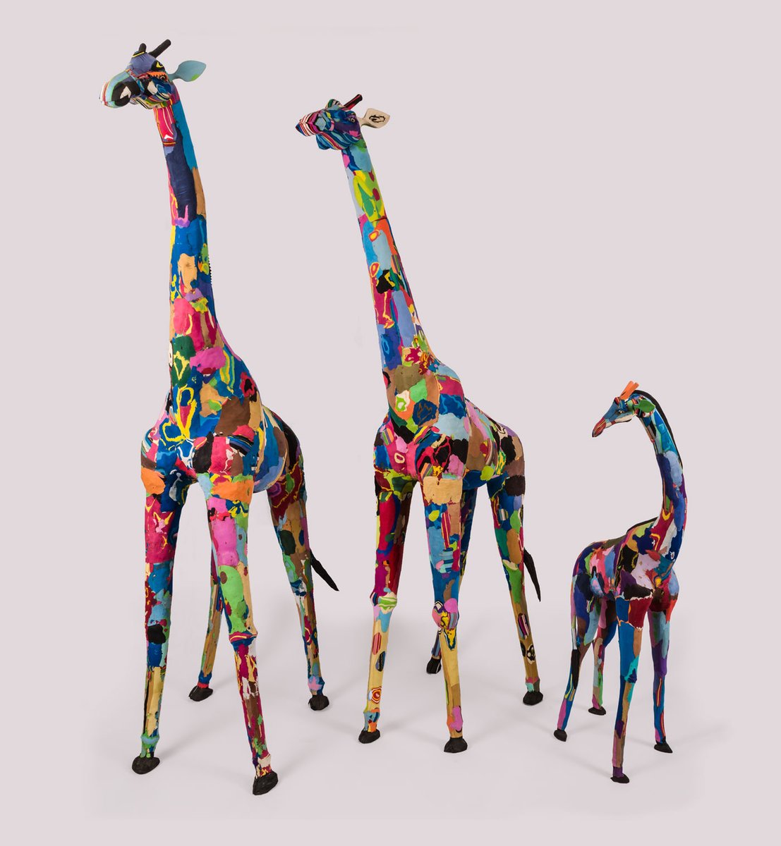 smithsonian's tweet photo. This giraffe family is made from flip-flops washed up on the Kenyan coast. Carvers Francis Mutua Muvua and Jonathan Lento of the Nairobi-based Ocean Sole project brought them to D.C. for @SmithsonianFolk's 2014 festival. More cultural heritage collections: https://t.co/CwmIqetUP9 https://t.co/pmnUMPVF7K
